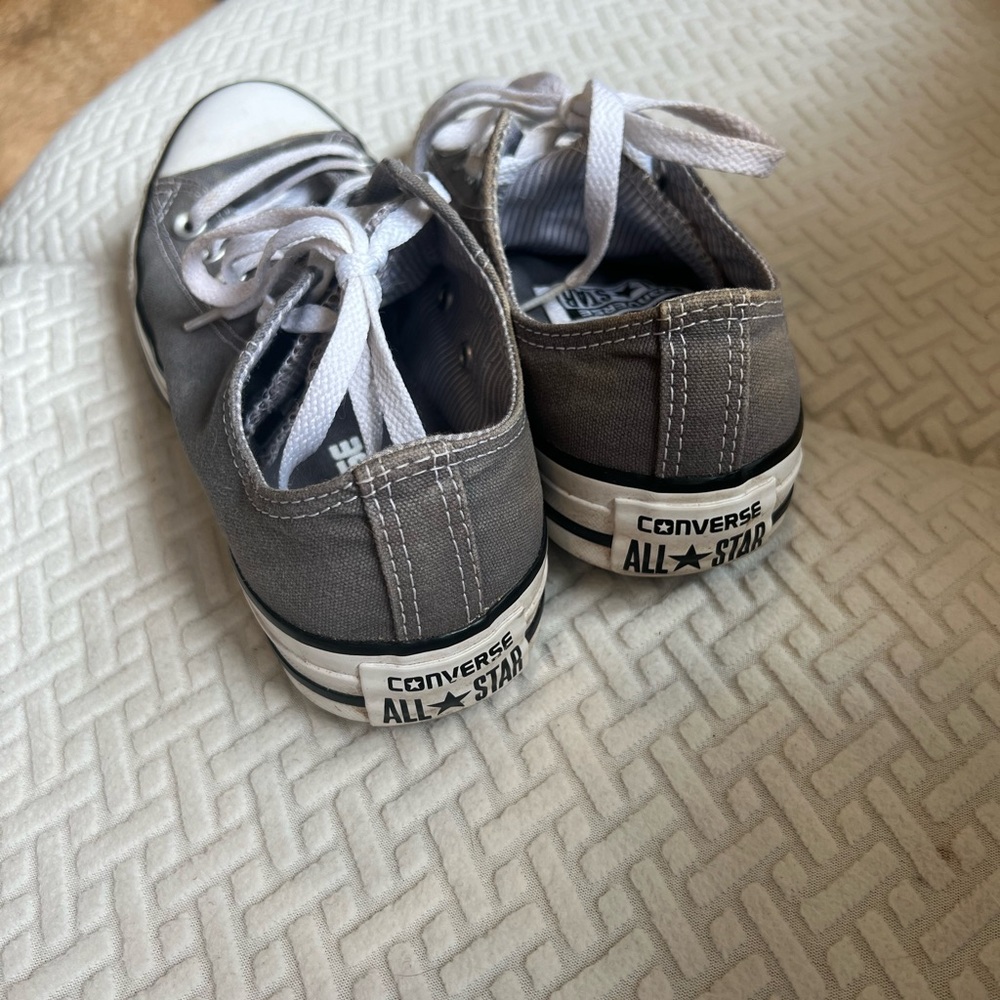 Grey women’s converse with a double tongue polka dot interior